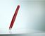 Picture of High-quality cosmetic tweezers made of red epoxy-coated stainless steel in classic design with fine straight tips.